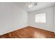 Bedroom featuring a window and wooden floor at 1574 Ward Frontier Ln, Henderson, NV 89002