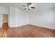 Spacious bedroom with wood floors, ceiling fan, and neutral paint at 1574 Ward Frontier Ln, Henderson, NV 89002