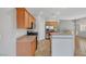 Kitchen featuring stainless steel appliances, wood cabinets and breakfast bar at 1574 Ward Frontier Ln, Henderson, NV 89002
