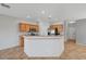 Kitchen with wood cabinets, breakfast bar, and modern appliances at 1574 Ward Frontier Ln, Henderson, NV 89002