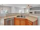 Kitchen with breakfast bar featuring stainless steel dishwasher and sink at 1574 Ward Frontier Ln, Henderson, NV 89002