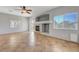 Spacious living room with tile flooring, fireplace, and lots of natural light at 1574 Ward Frontier Ln, Henderson, NV 89002
