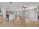 Bright living room with open layout, tile flooring, stainless steel appliances and natural light at 1574 Ward Frontier Ln, Henderson, NV 89002