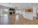 Spacious living room featuring a fireplace, tile flooring, and open layout to the kitchen at 1574 Ward Frontier Ln, Henderson, NV 89002
