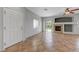 Open-concept living room with fireplace and sliding glass doors to patio at 1574 Ward Frontier Ln, Henderson, NV 89002