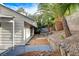Backyard featuring a well-maintained lawn and a charming rock garden, creating a tranquil outdoor retreat at 1600 Becke Cir, Las Vegas, NV 89104