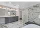 Well-appointed bathroom with double vanity, glass-enclosed shower, and soaking tub with luxurious fixtures at 1600 Becke Cir, Las Vegas, NV 89104