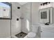 Stylish bathroom featuring a tiled shower, modern vanity, mirror, and black fixtures at 1600 Becke Cir, Las Vegas, NV 89104