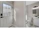 Clean bathroom with toilet and sink visible through entryway with marble floors and modern fixtures at 1600 Becke Cir, Las Vegas, NV 89104