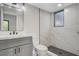 Modern bathroom featuring updated vanity, toilet and large walk-in shower at 1600 Becke Cir, Las Vegas, NV 89104