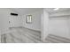 Bright bedroom featuring an open closet and wood-style flooring at 1600 Becke Cir, Las Vegas, NV 89104
