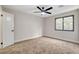 Bedroom featuring neutral tones, a window for natural light, and a ceiling fan at 1600 Becke Cir, Las Vegas, NV 89104