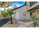 Home exterior featuring an inviting entrance and lush landscaping, creating a warm and welcoming ambiance at 1600 Becke Cir, Las Vegas, NV 89104