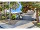 Two-story home featuring a two-car garage and landscaped front yard at 1600 Becke Cir, Las Vegas, NV 89104