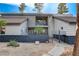 Charming home featuring a balcony, brick accents and metal fence, enhancing its curb appeal at 1600 Becke Cir, Las Vegas, NV 89104