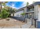 Charming two-story home with a gated front yard and well-maintained landscaping at 1600 Becke Cir, Las Vegas, NV 89104