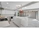 Contemporary kitchen featuring stainless steel appliances, marble island and vaulted ceiling at 1600 Becke Cir, Las Vegas, NV 89104