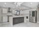 Stylish kitchen featuring a center island, stainless appliances and white cabinets at 1600 Becke Cir, Las Vegas, NV 89104