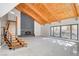 Bright living room with vaulted wood ceiling, sleek fireplace, and modern staircase at 1600 Becke Cir, Las Vegas, NV 89104