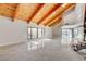 Bright living area filled with natural light, wood beam ceilings, and a marble floor at 1600 Becke Cir, Las Vegas, NV 89104