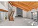 Open-concept living area showcasing a fireplace, and staircase, filled with natural light at 1600 Becke Cir, Las Vegas, NV 89104