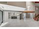 Bright open-plan living space with high ceilings, marble floors, and a modern kitchen at 1600 Becke Cir, Las Vegas, NV 89104