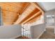 View from the loft overlooking the living room with exposed wood beams and high ceilings at 1600 Becke Cir, Las Vegas, NV 89104