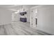 Bright living room features sleek flooring, contemporary finishes and access to the ensuite bathroom at 1600 Becke Cir, Las Vegas, NV 89104