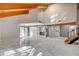 Open living room with gleaming floors, exposed wood beams, and seamless flow to other living spaces at 1600 Becke Cir, Las Vegas, NV 89104