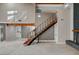 Bright living room with staircase, fireplace, and high ceilings featuring wood beam accents at 1600 Becke Cir, Las Vegas, NV 89104