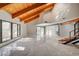 Bright open living area features natural light, with wood beam ceilings, and a staircase at 1600 Becke Cir, Las Vegas, NV 89104