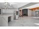 Open-concept living and kitchen space with fireplace and stainless steel refrigerator at 1600 Becke Cir, Las Vegas, NV 89104
