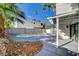 A backyard oasis showcasing a private pool, patio and lush palm trees for ultimate relaxation at 1600 Becke Cir, Las Vegas, NV 89104