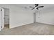 Spacious bedroom featuring a ceiling fan, and 2 doors at 163 Greenbriar Townhouse Way, Las Vegas, NV 89121