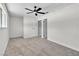 Spacious bedroom featuring a ceiling fan, and 2 doors at 163 Greenbriar Townhouse Way, Las Vegas, NV 89121