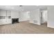 Bright living room with modern floors, fireplace and built in cabinets at 163 Greenbriar Townhouse Way, Las Vegas, NV 89121