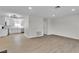 Bright and spacious living room featuring sleek wood floors and a modern open floor plan at 163 Greenbriar Townhouse Way, Las Vegas, NV 89121