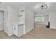 Bright and modern living room featuring custom shelving and updated lighting fixture at 163 Greenbriar Townhouse Way, Las Vegas, NV 89121