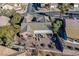 Aerial view of a desert home with a backyard patio, surrounded by mature trees at 2039 Colvin Run Dr, Henderson, NV 89052