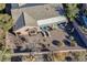 Aerial view of a backyard with a covered patio, lounge chairs, and desert landscaping with a privacy fence at 2039 Colvin Run Dr, Henderson, NV 89052