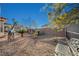 Backyard features statues, privacy wall, desert landscaping, and outdoor seating at 2039 Colvin Run Dr, Henderson, NV 89052