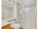 Modern bathroom features a large glass enclosed shower, toilet, and vanity at 2039 Colvin Run Dr, Henderson, NV 89052