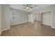 Spacious bedroom with hardwood floors, closet with sliding mirror doors, and neutral paint at 2039 Colvin Run Dr, Henderson, NV 89052