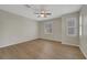 Cozy bedroom with hardwood floors, shutters, and neutral paint at 2039 Colvin Run Dr, Henderson, NV 89052