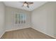 Bedroom with hardwood floors, neutral paint, and shutters at 2039 Colvin Run Dr, Henderson, NV 89052