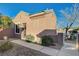 Cozy home featuring a tiled roof, side gate, and meticulously maintained desert landscaping at 2039 Colvin Run Dr, Henderson, NV 89052
