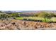 Scenic golf course with a line of golf carts parked, set against a mountain backdrop at 2039 Colvin Run Dr, Henderson, NV 89052