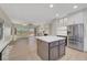 Open-concept kitchen with a center island, stainless steel appliances, and a seamless flow to the living area at 2039 Colvin Run Dr, Henderson, NV 89052
