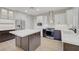 Stylish kitchen featuring stainless steel appliances, white countertops, and custom cabinetry at 2039 Colvin Run Dr, Henderson, NV 89052