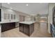 Open kitchen featuring modern appliances, a kitchen island, and views to the backyard at 2039 Colvin Run Dr, Henderson, NV 89052